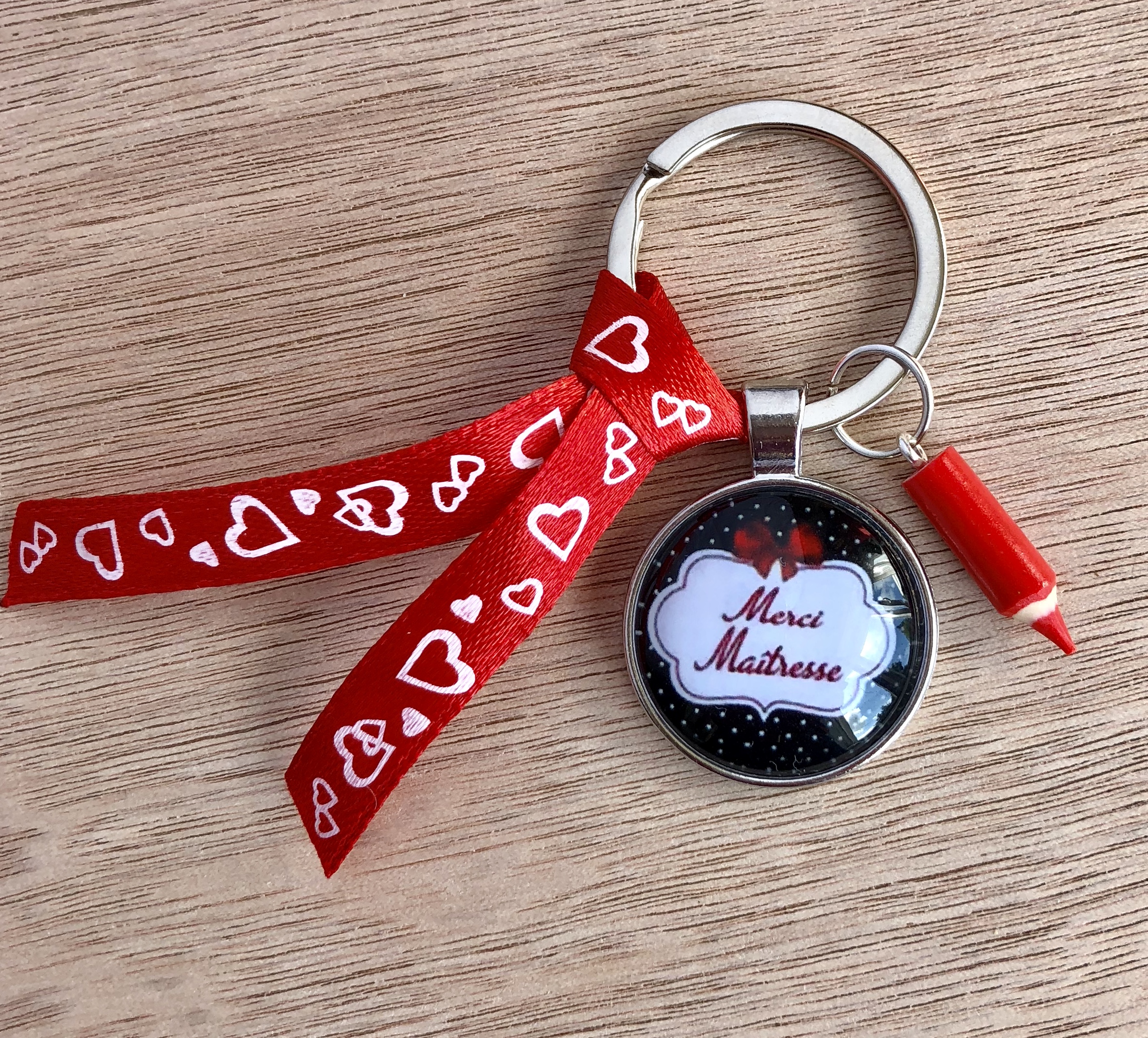 Un Porte clé merci maitresse noeud rouge/noir
